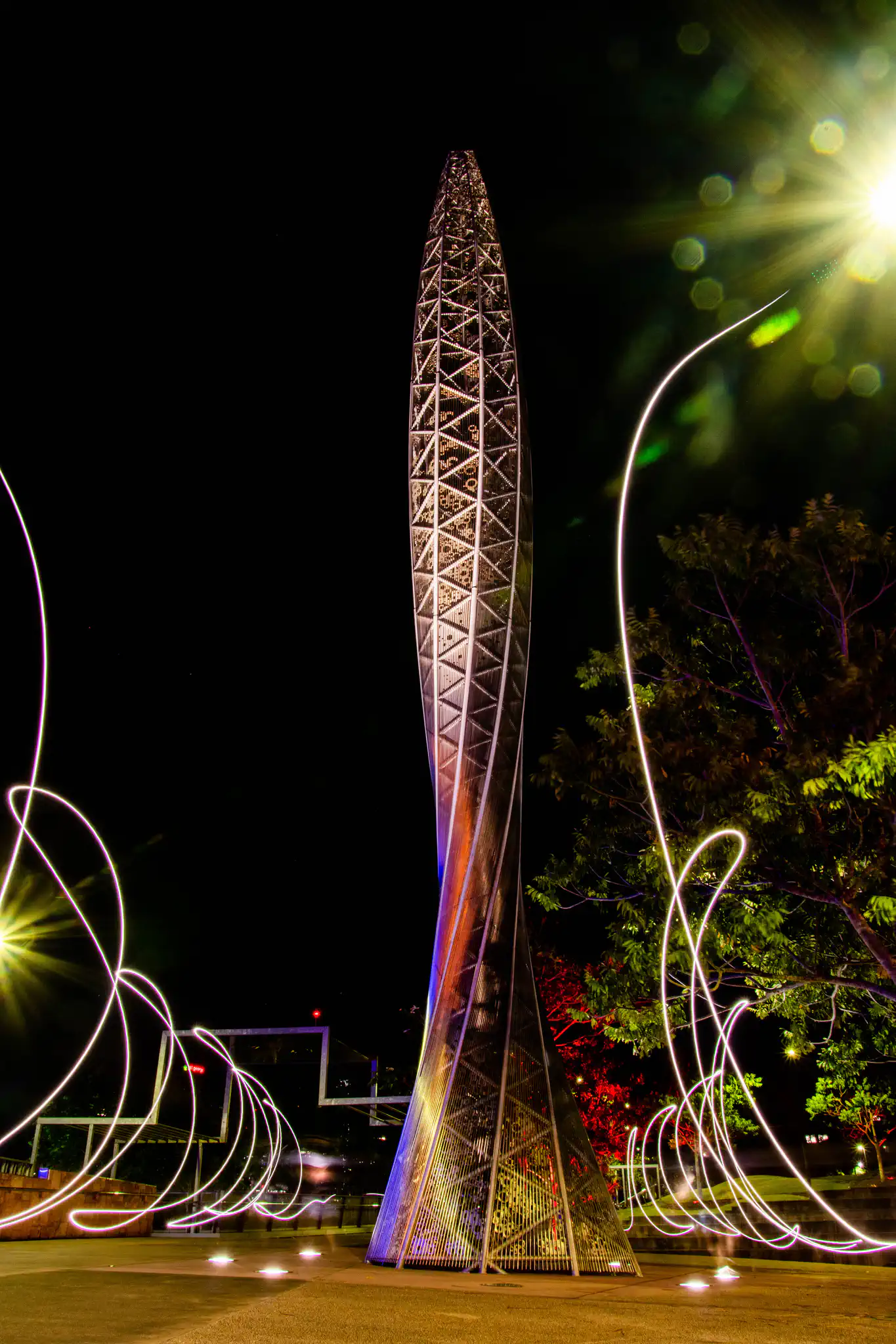 Illuminated tower sculpture at night